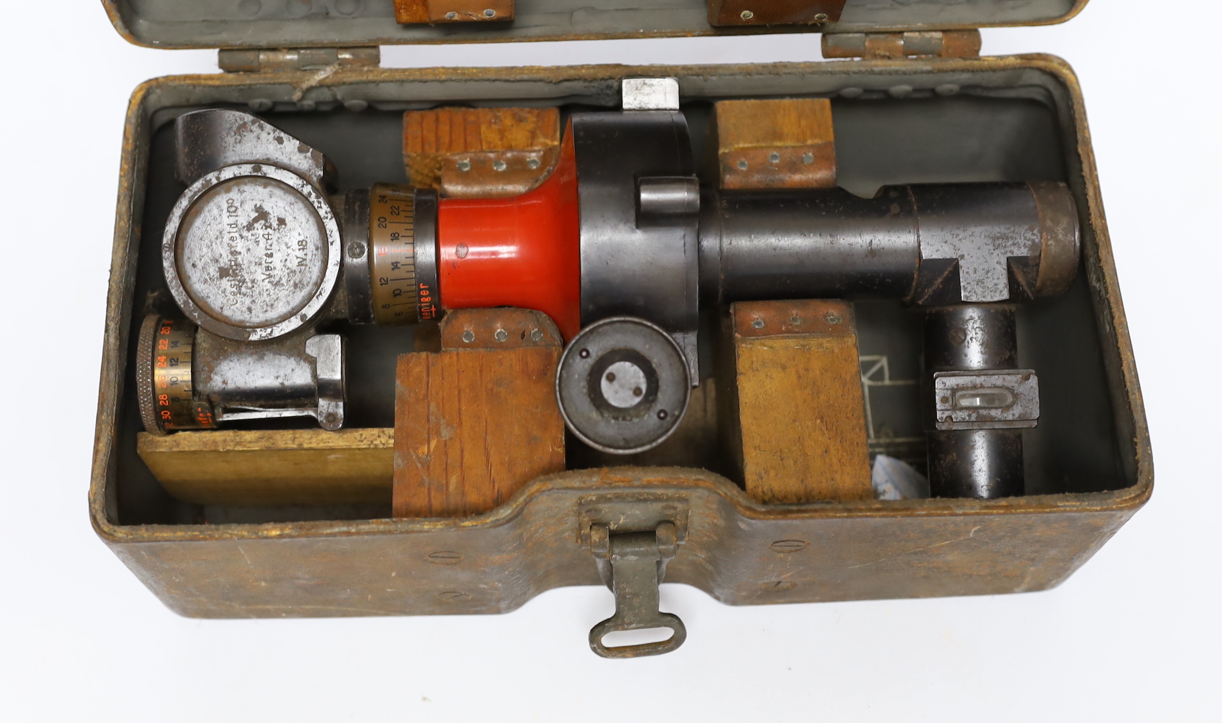 A German WWI gun sight, marked; ‘Gesichtsfeld 10°” (10 degrees field of vision) and “Vergr. x 4” (abbreviation of Vergrößerung [= magnification] x 4)’, in a fitted steel box, 25 x 11 x 12cm